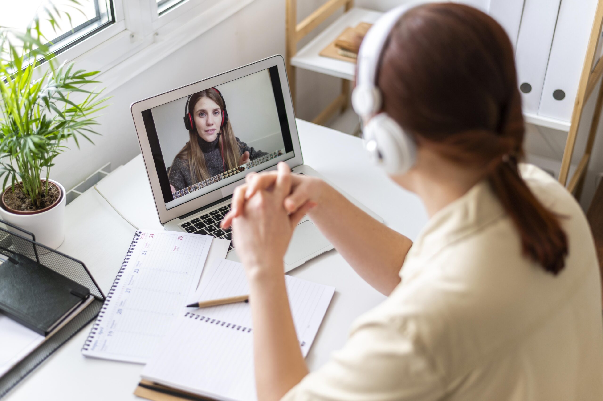 portrait-woman-work-having-video-call-laptop